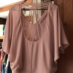Blush blouse with cross straps on the back